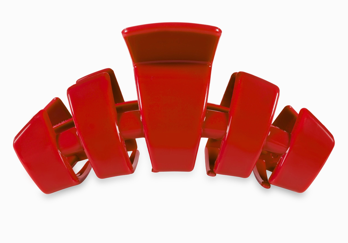 Red hair clip on a white background