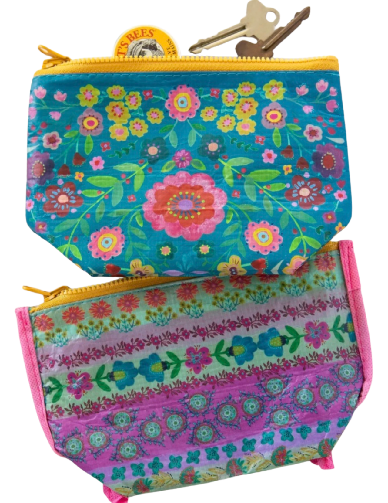 Two floral-patterned pouches with zippers on a white background