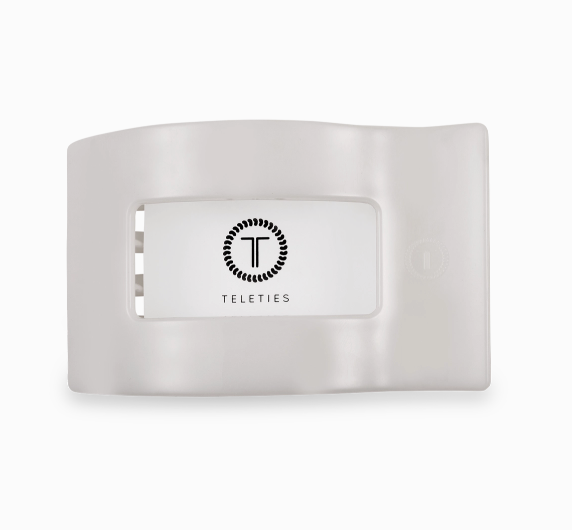 White hair clip with 'Teleties' branding on a white background