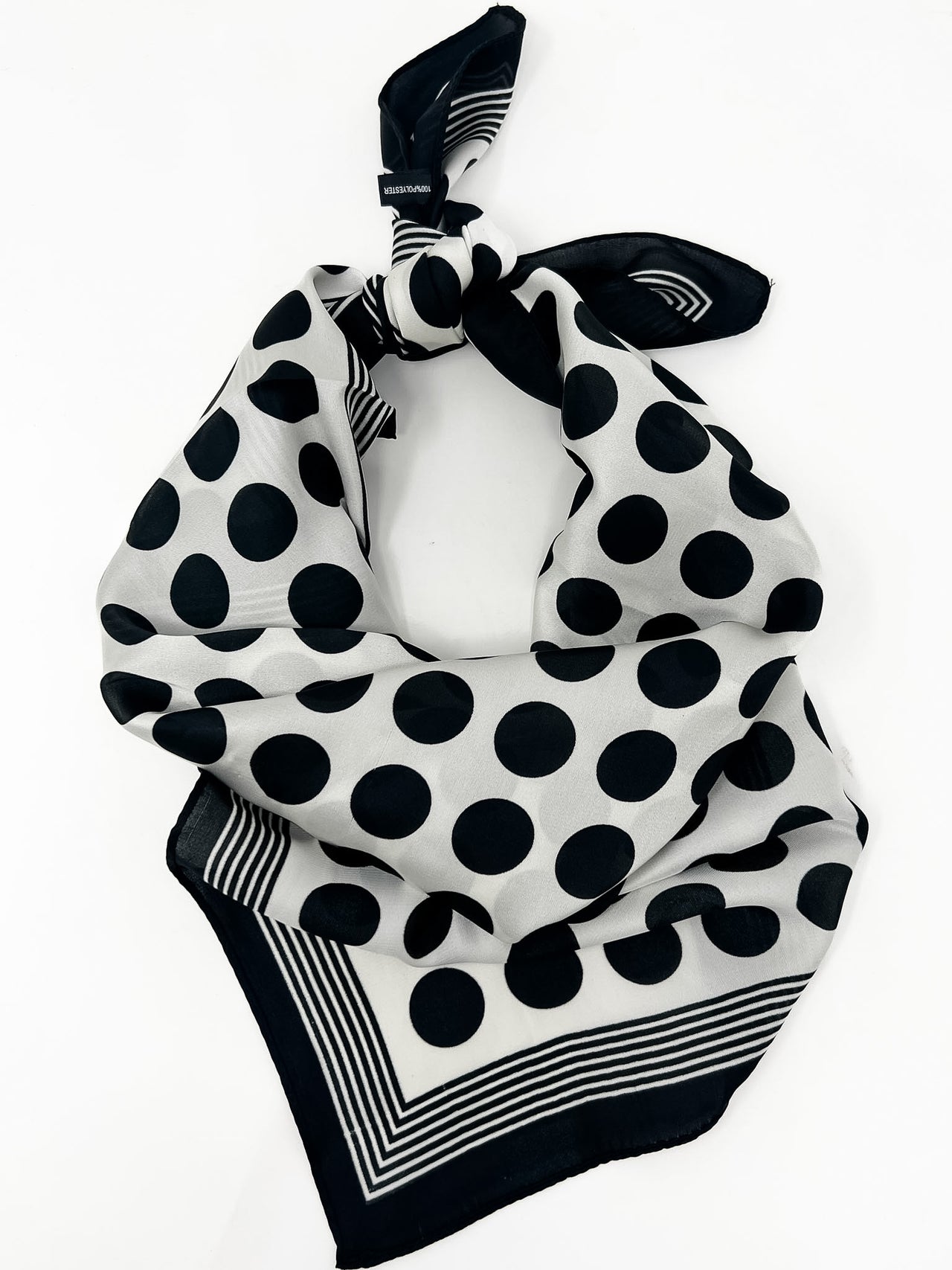 black and white polka-dot scarf on a white background