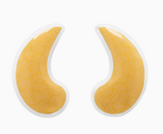 Two crescent-shaped yellow eye patches with a repeating wave pattern and white borders, shown on a plain white background.