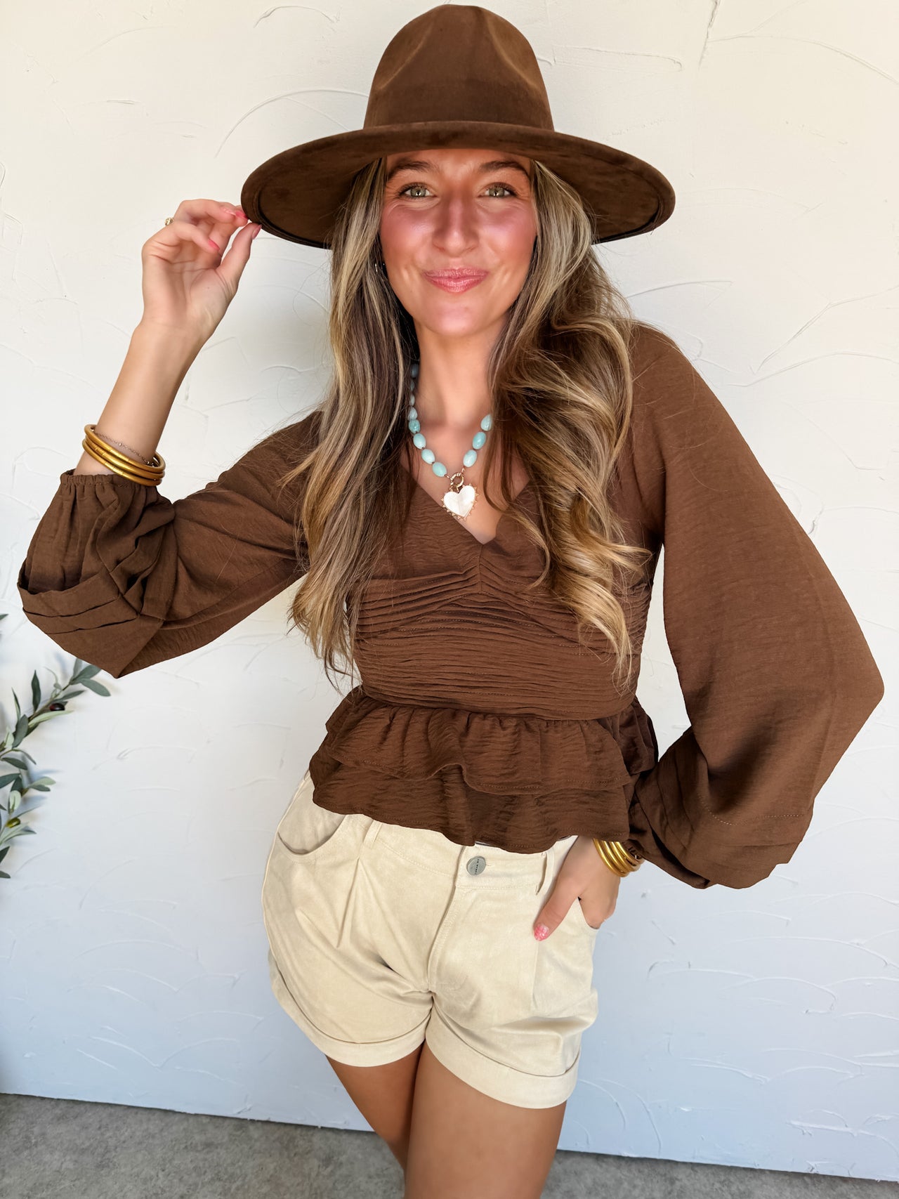 Keep You Close Brown Ruched Peplum Top