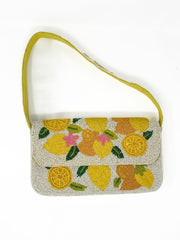Beaded handbag with lemon pattern on a white background