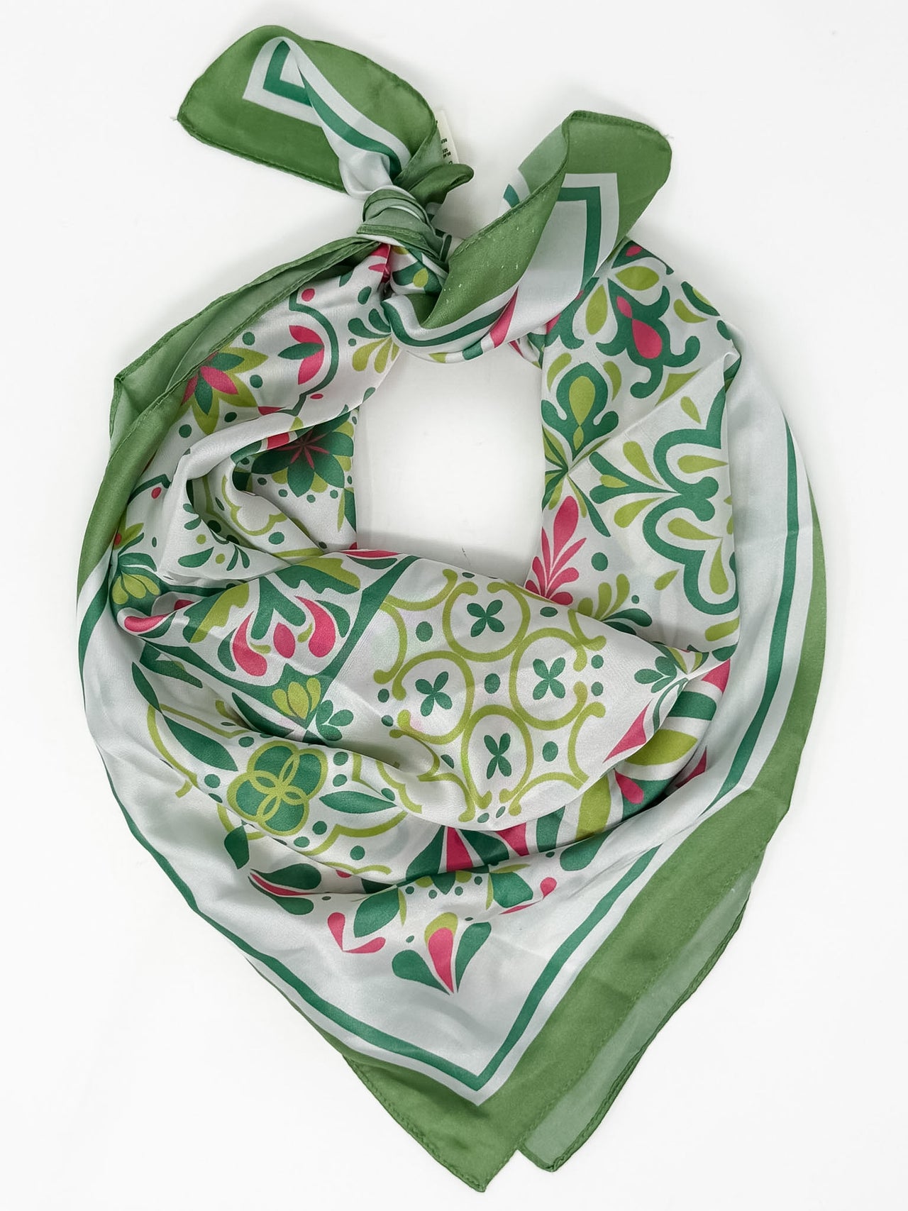 Green and white patterned scarf on a white background
