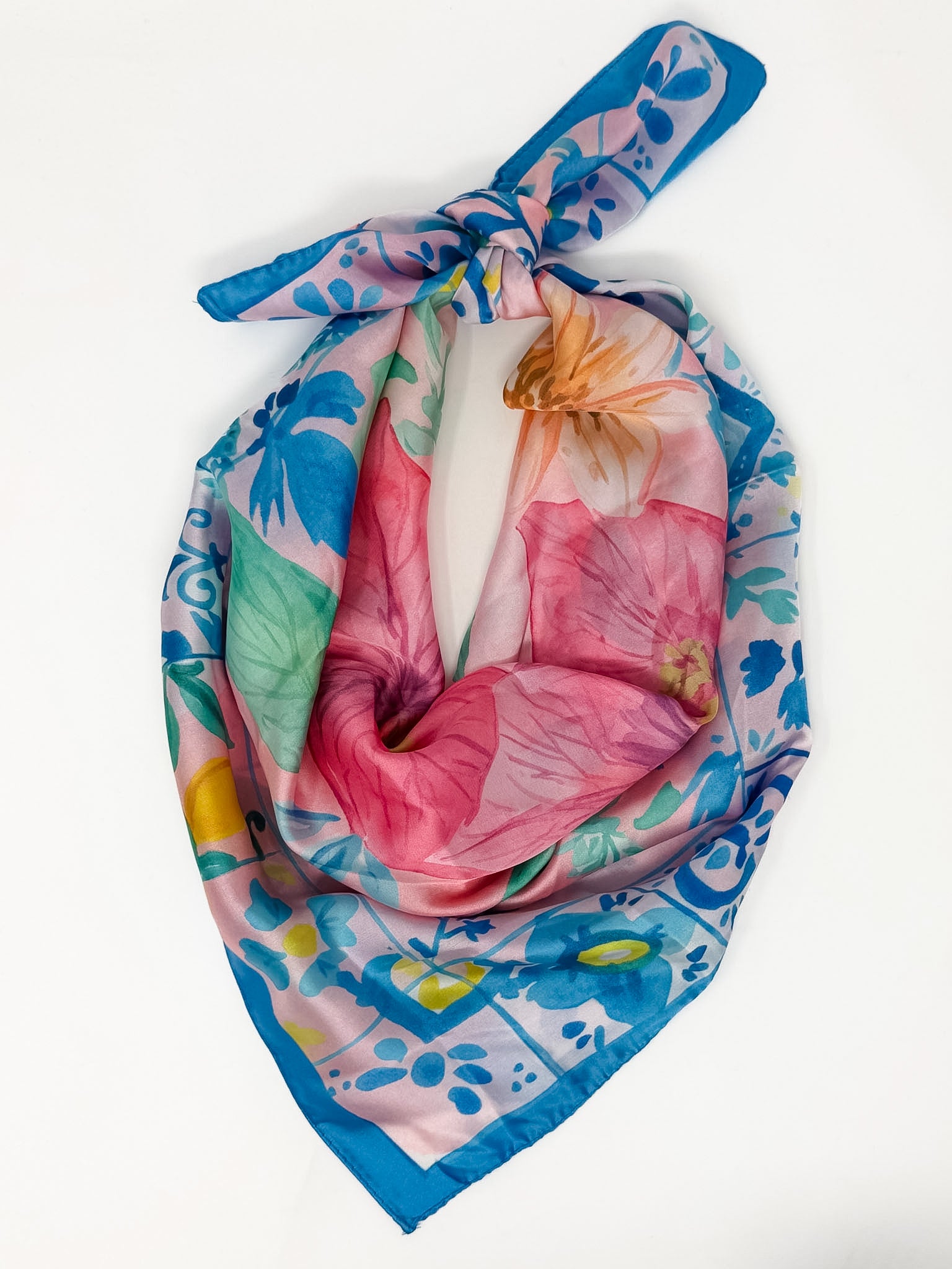 Colorful floral headscarf on a white background