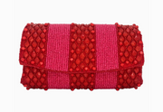 Red and pink striped beaded clutch bag with beaded details on a white background