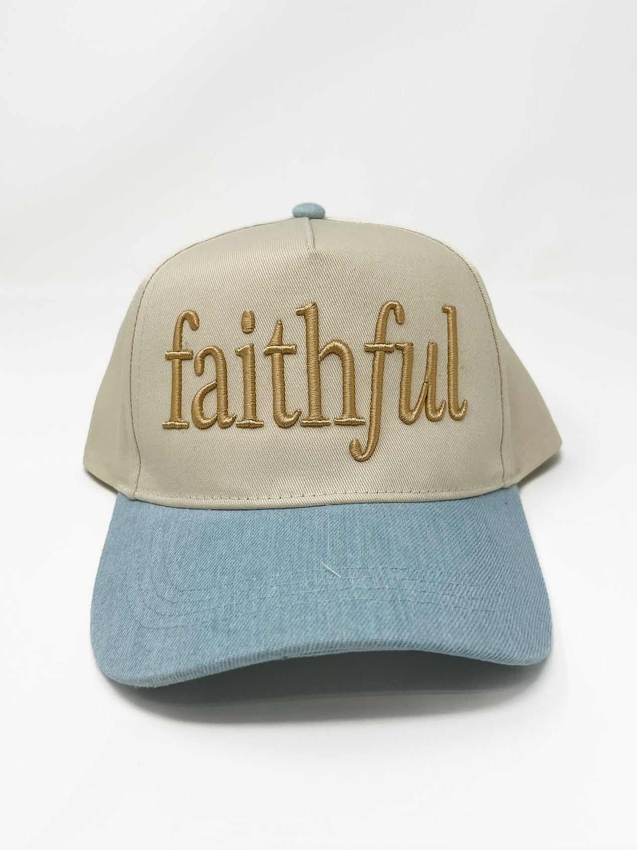 Cream and light blue two-tone baseball cap with raised “faithful” embroidery on the front.