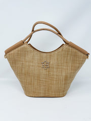 Woven handbag with brown handle and logo on a white background