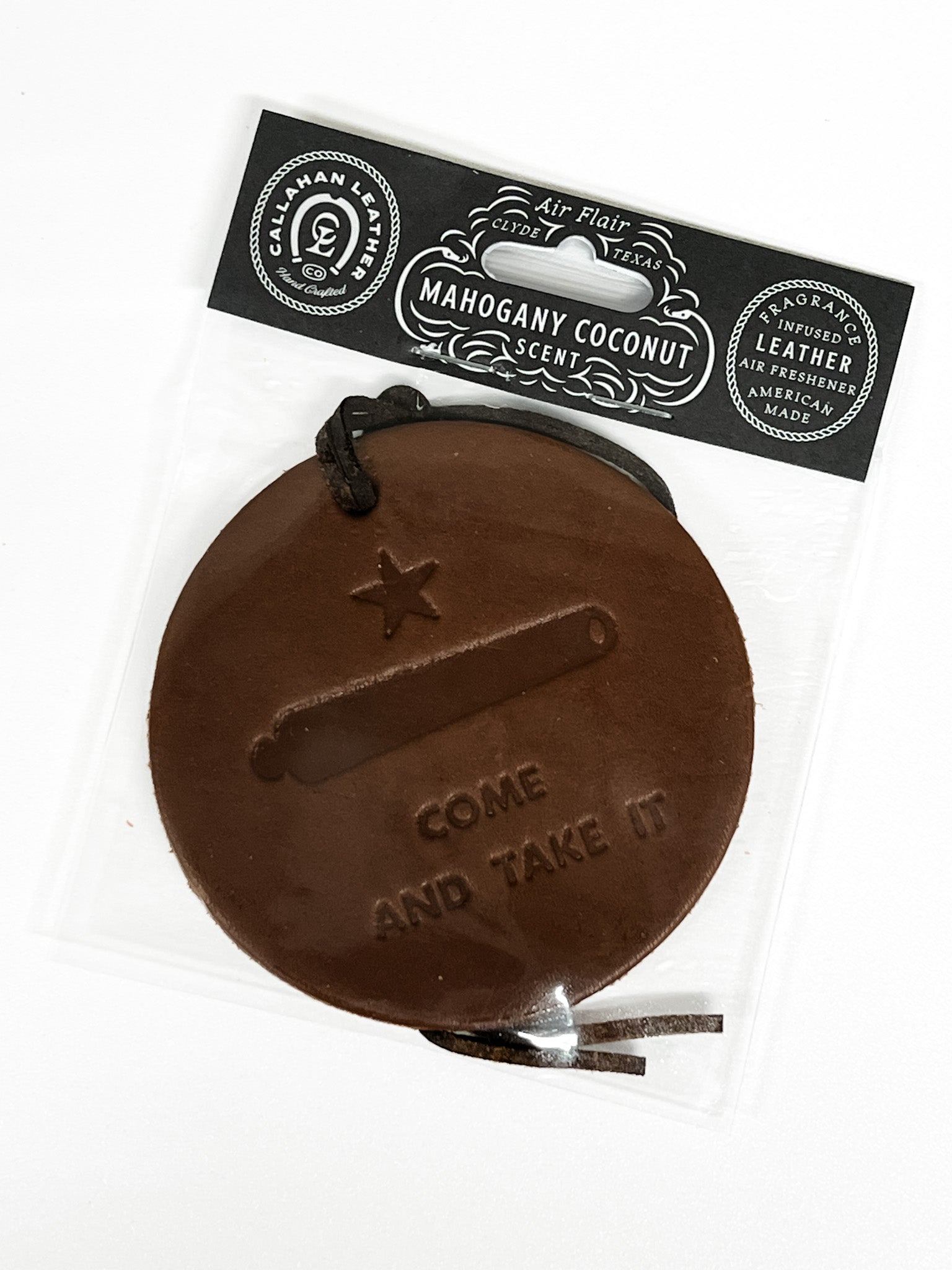 Brown leather car freshener tag with 'Come and Take It' engraving on a white background