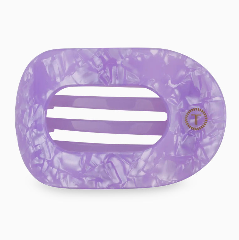 Purple marbled hair clip with a brand logo on a white background