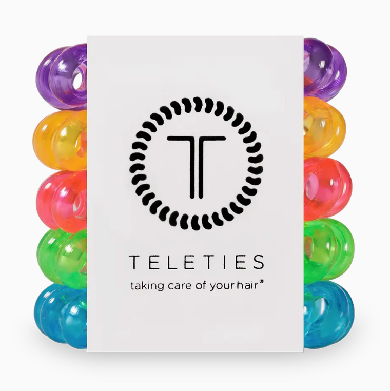 Colorful hair ties in a box with Teleties branding on a white background