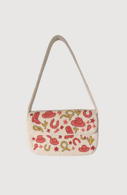 Small beaded handbag with cowboy-themed pattern on a light background