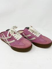 Pink slide on sneakers with white laces on a white background