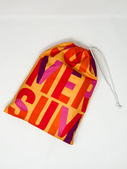 Colorful drawstring Towel, and bag with abstract patterns on a white background