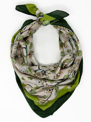 Floral patterned scarf with green accents on a white background