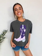 Woman wearing a dark gray t-shirt with a purple cowboy boot design on a white background