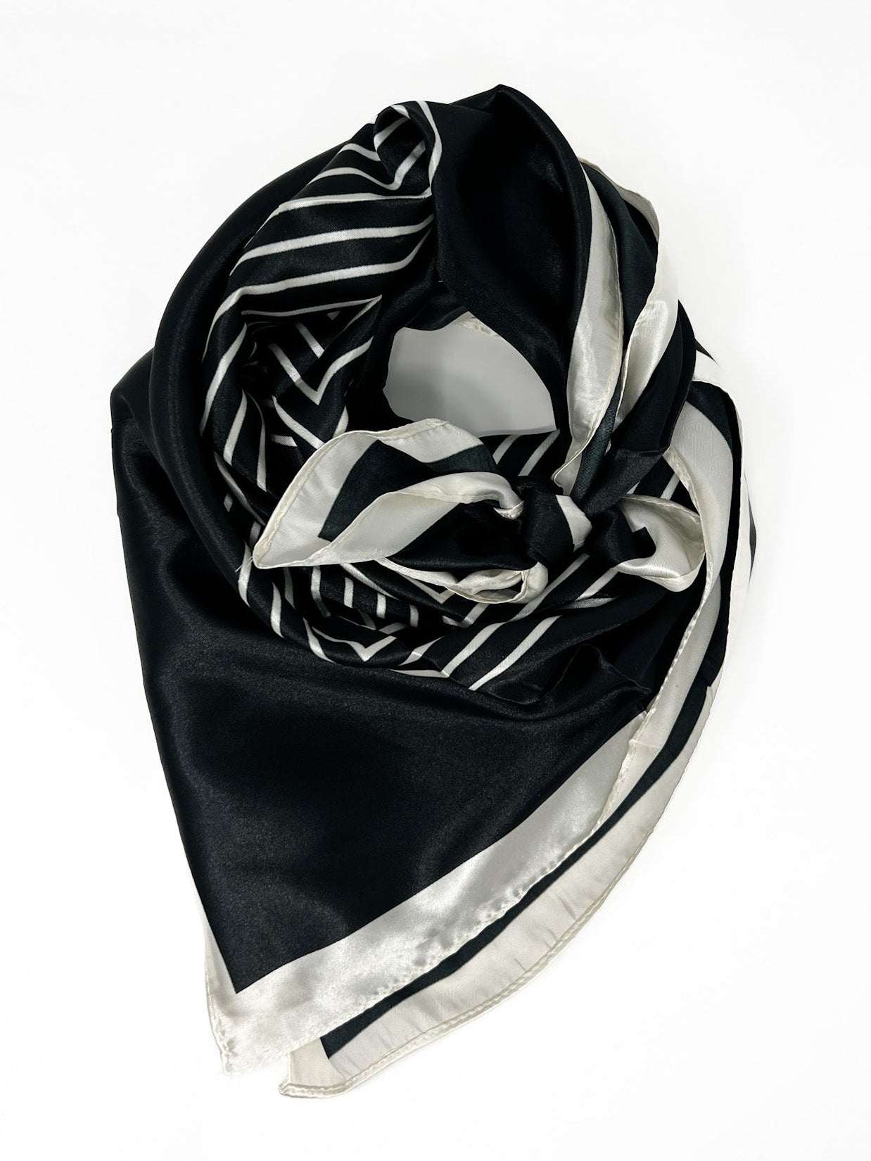 Black and white patterned scarf on a white background