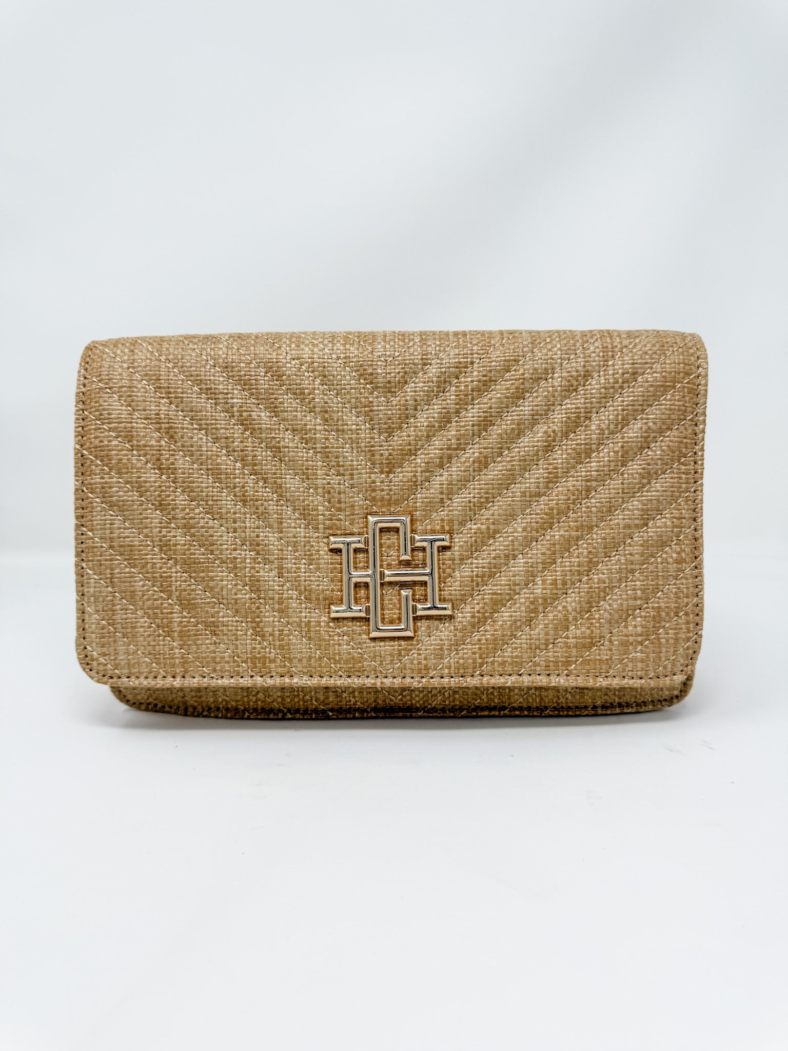 Beige textured clutch bag with a logo on a white background