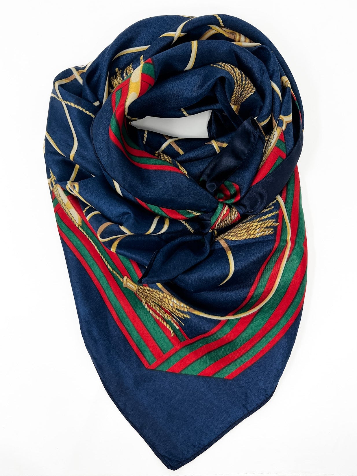 Navy blue scarf with red and green stripes and gold patterns on a white background