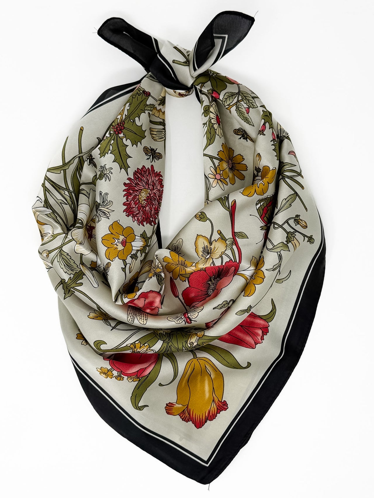 Floral patterned scarf with black border on a white background
