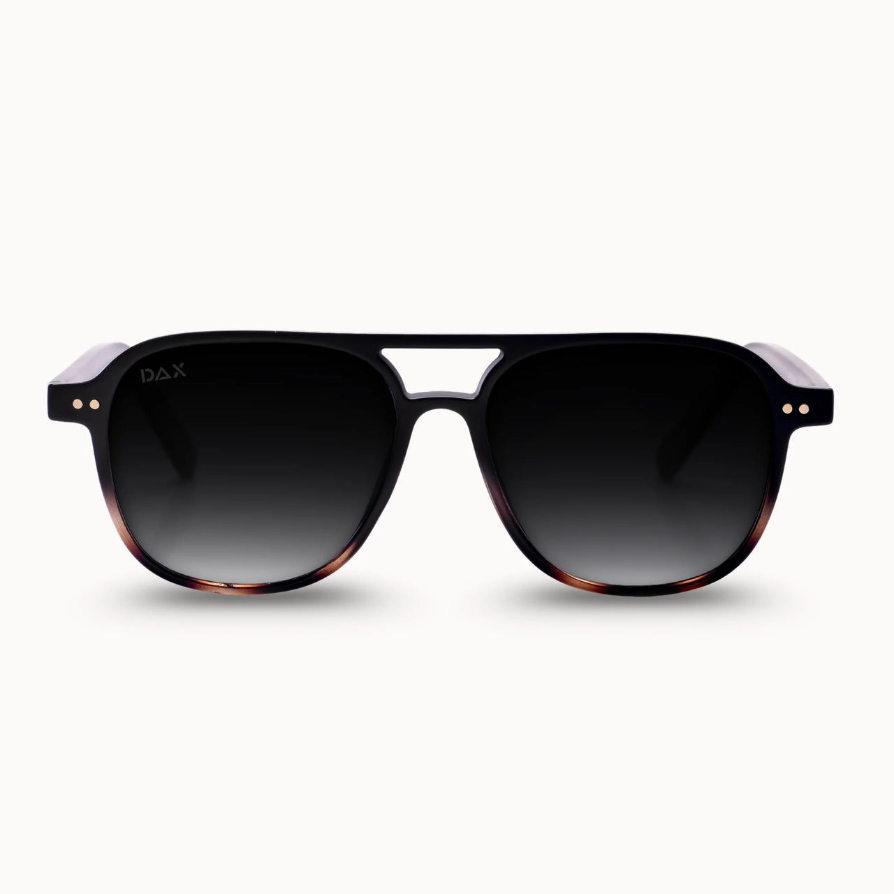 Sunglasses with a tortoiseshell frame and dark lenses on a white background