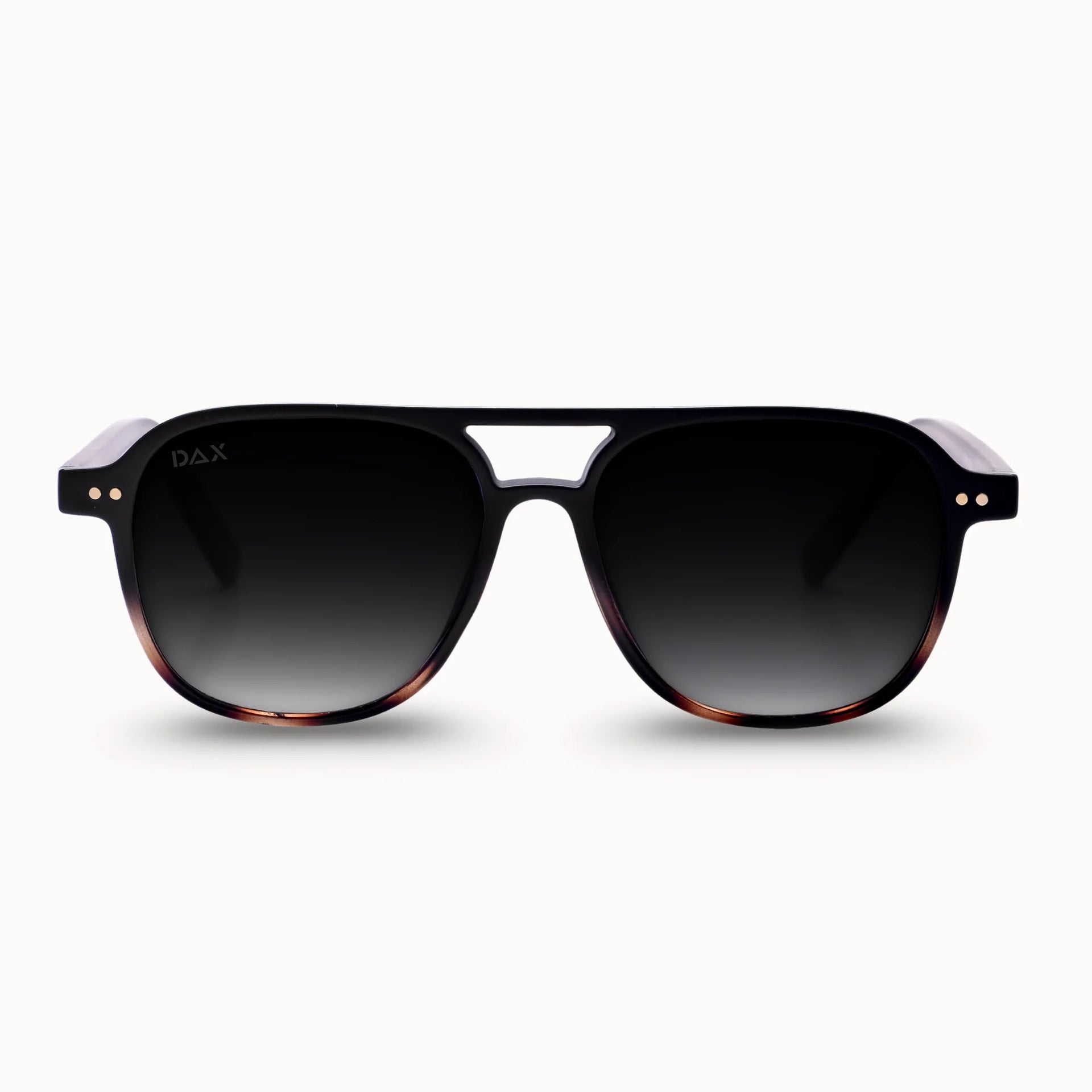 Sunglasses with a tortoiseshell frame and dark lenses on a white background