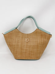 Woven handbag with mint blue detail and a logo on a white background