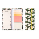 A floral-themed pocket organizer shown open, featuring a patterned exterior, pastel interior card sections, and a yellow elastic closure band.