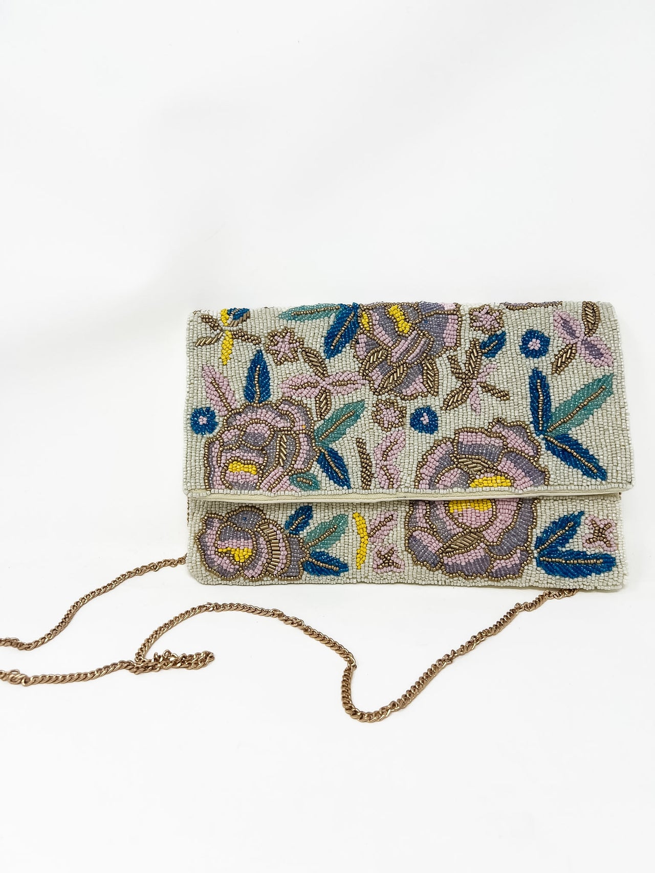 Embroidered beaded clutch bag with floral patterns on a white background