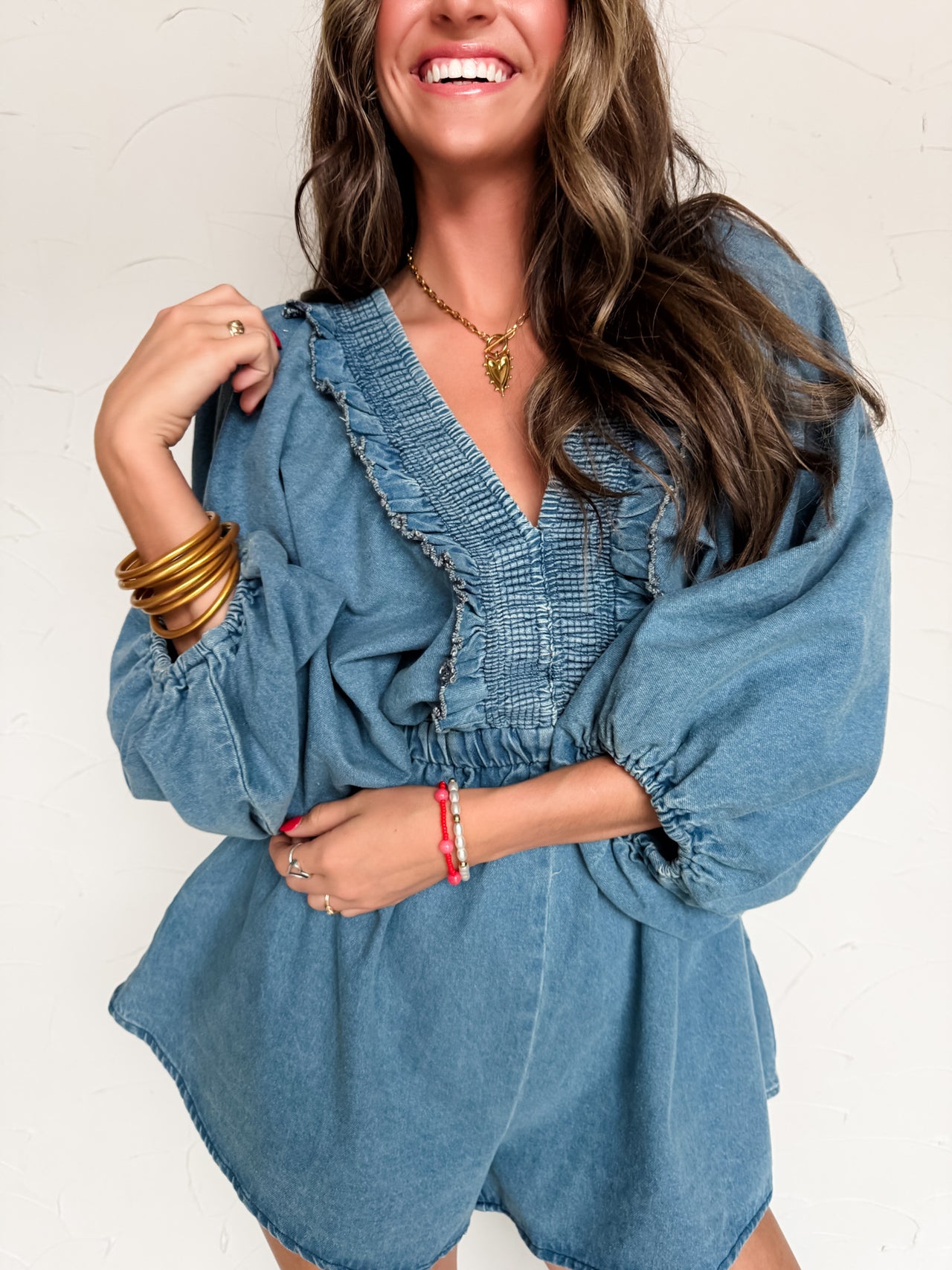 Fell For You Smocked And Ruffled Denim Romper