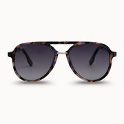 Sunglasses with tortoiseshell frame and dark lenses on a white background