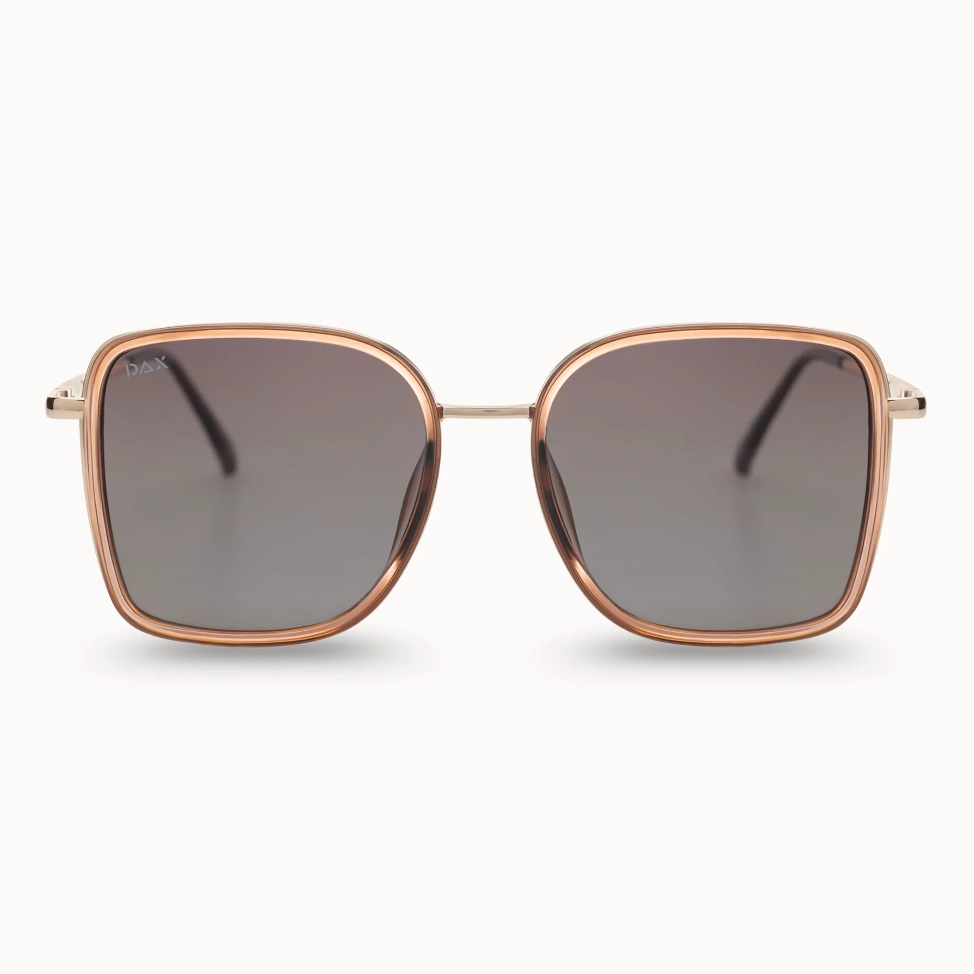 Sunglasses with rose gold frame and dark lenses on a white background