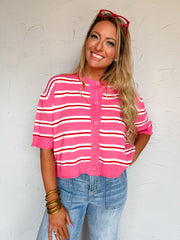 Brand: LovLov
Color: Pink/Red, with white stripe accents
Horizontal striped design
Button-front cardigan
Short sleeves
Round neckline
Ribbed neckline, cuffs, and hem
Fabric content: 50% viscose, 28% nylon, 22% polyester