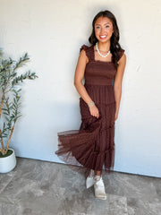 In Her Element Polka Dot Chiffon Midi Dress by Blu Pepper in 100% polyester, featuring warm brown dotted fabric, ruffled shoulder straps, a smocked bodice, and a tiered skirt.