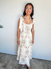 Fit The Plan Tie Shoulder Midi Dress by Blu Pepper in 100% polyester, with an ivory botanical floral print, wide shoulder bows, and a smocked back.