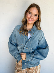 Good Company Mineral Washed Denim Jacket by Eesome in 90% cotton and 10% polyester, featuring blue denim, balloon sleeves, a stand collar, snap front, and large patch pockets.