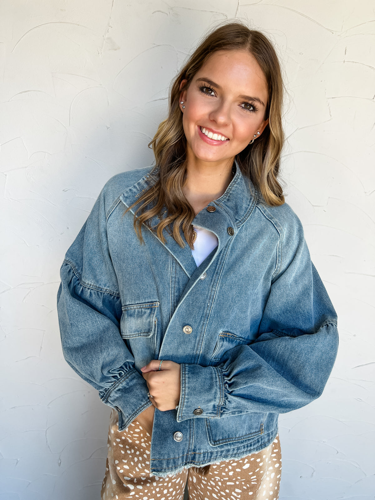 Good Company Mineral Washed Denim Jacket by Eesome in 90% cotton and 10% polyester, featuring blue denim, balloon sleeves, a stand collar, snap front, and large patch pockets.