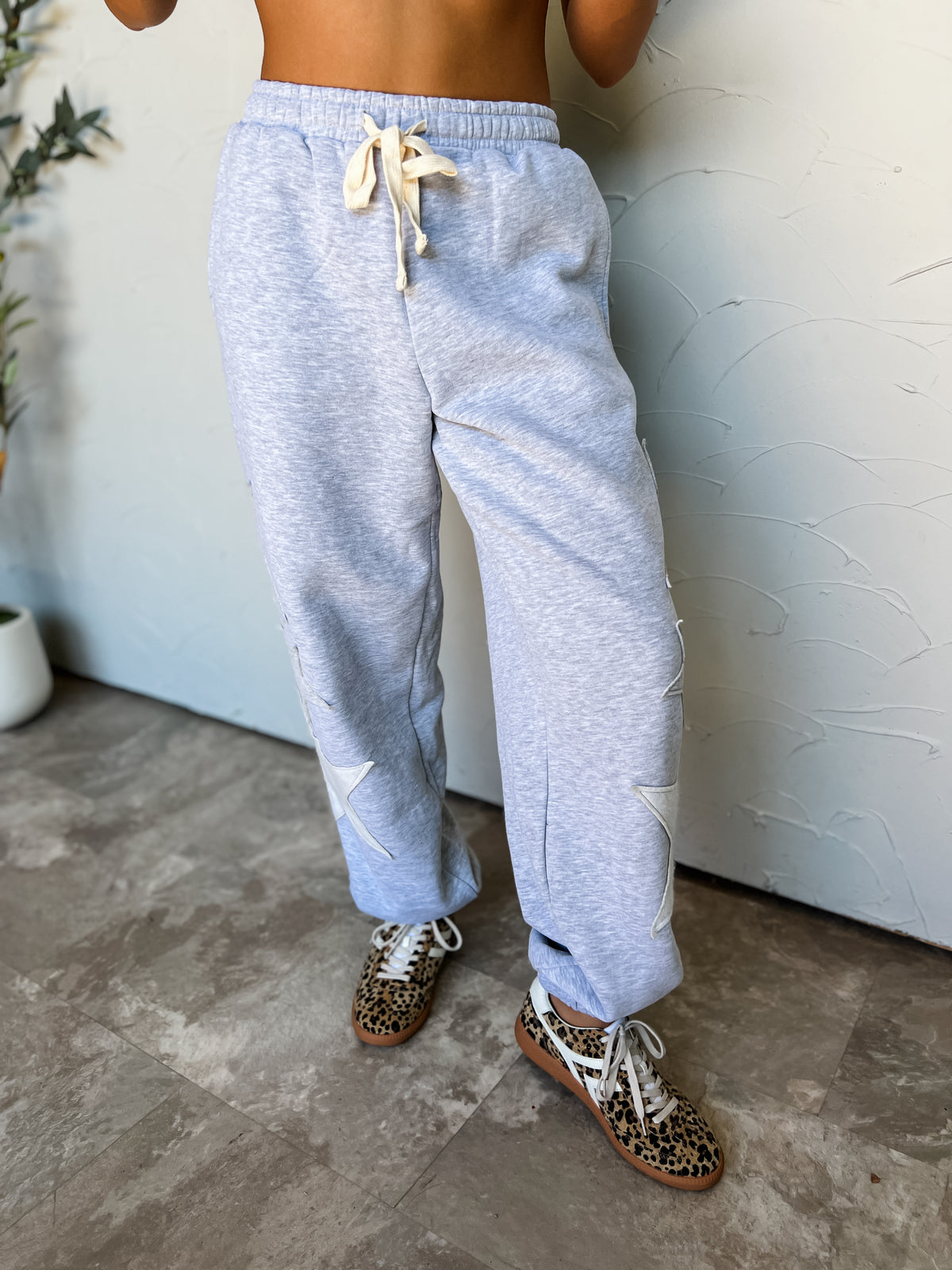 On My Terms Grey Sweatpants by Hyfve in 60% cotton and 40% polyester, with tonal star appliqués, a cream drawstring waist, and gathered ankle hems