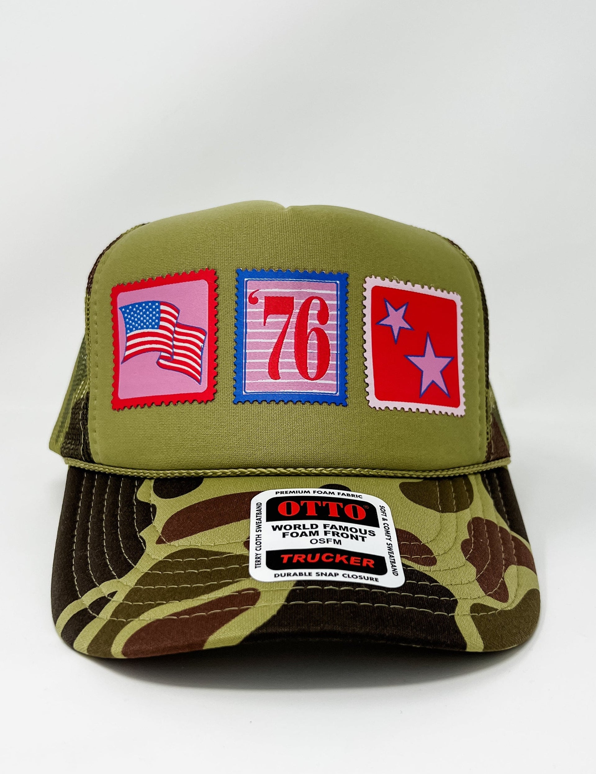 Green and camouflage trucker hat with patches on a white background
