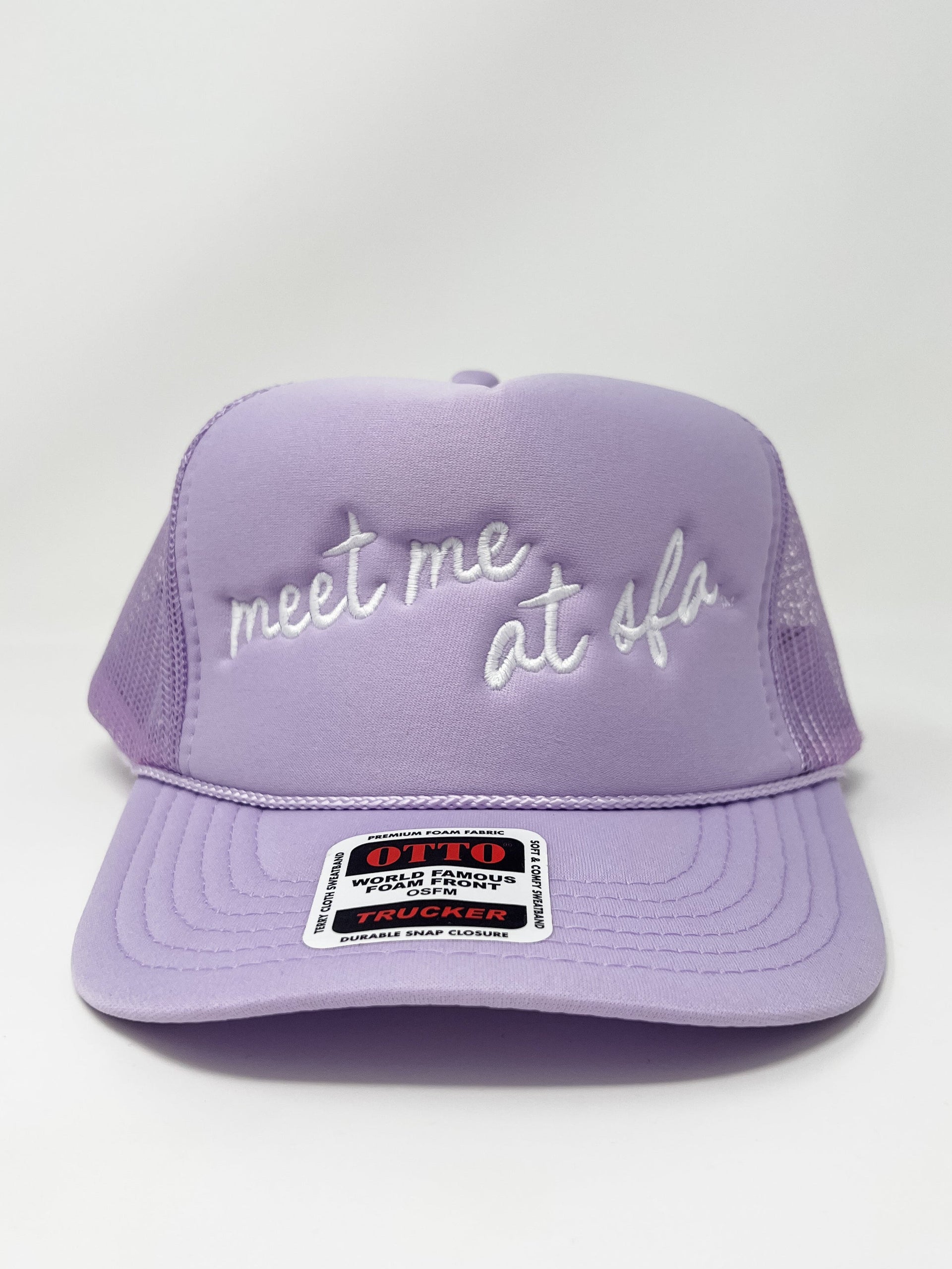 Purple cap with embroidered text on a white background