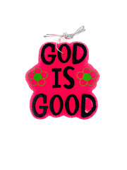 Pink paw-shaped sign with 'GOD IS GOOD' text on a white background
