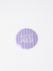 A round pin badge featuring a light purple and lavender-white vertical striped pattern with the text 'AXE 'EM JACKS!' in white, shown on a plain white background.