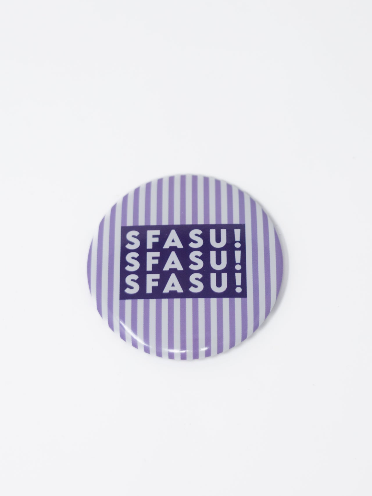 A round pin-back button badge featuring a purple and white vertical stripe pattern, with a dark purple central block containing the text 'SFASU! SFASU! SFASU!' in white.