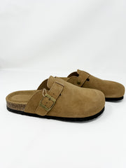 A pair of Project Cloud brand chestnut-brown suede clogs displayed against a clean white background. The slip-on mule-style shoes feature a closed round toe, a matching adjustable instep strap with a brass metal buckle, a contoured tan footbed with a lightweight cork-wrapped midsole, and a thin black non-slip rubber outsole.