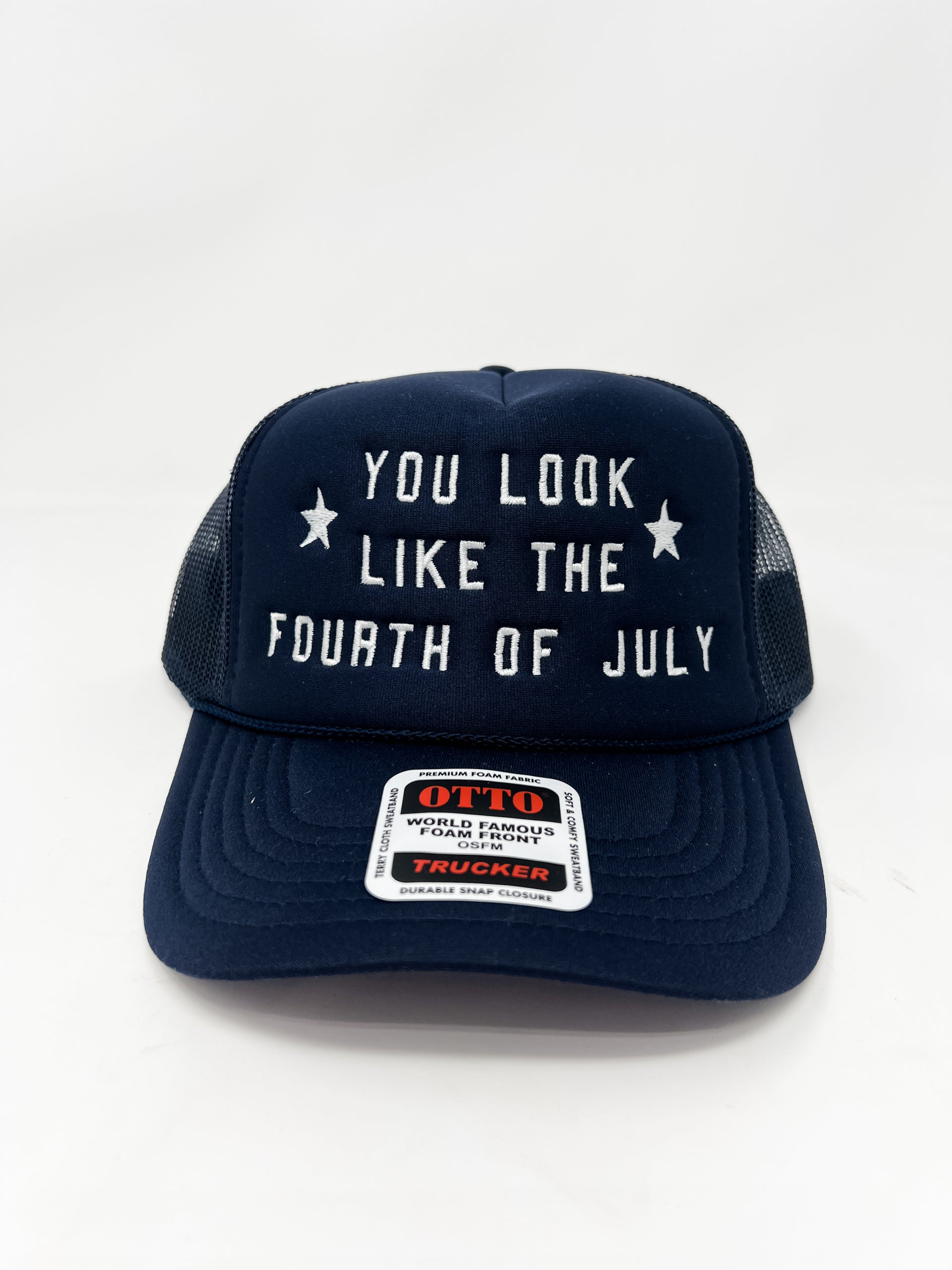 Navy blue trucker hat with 'You look like the Fourth of July' text on a white background
