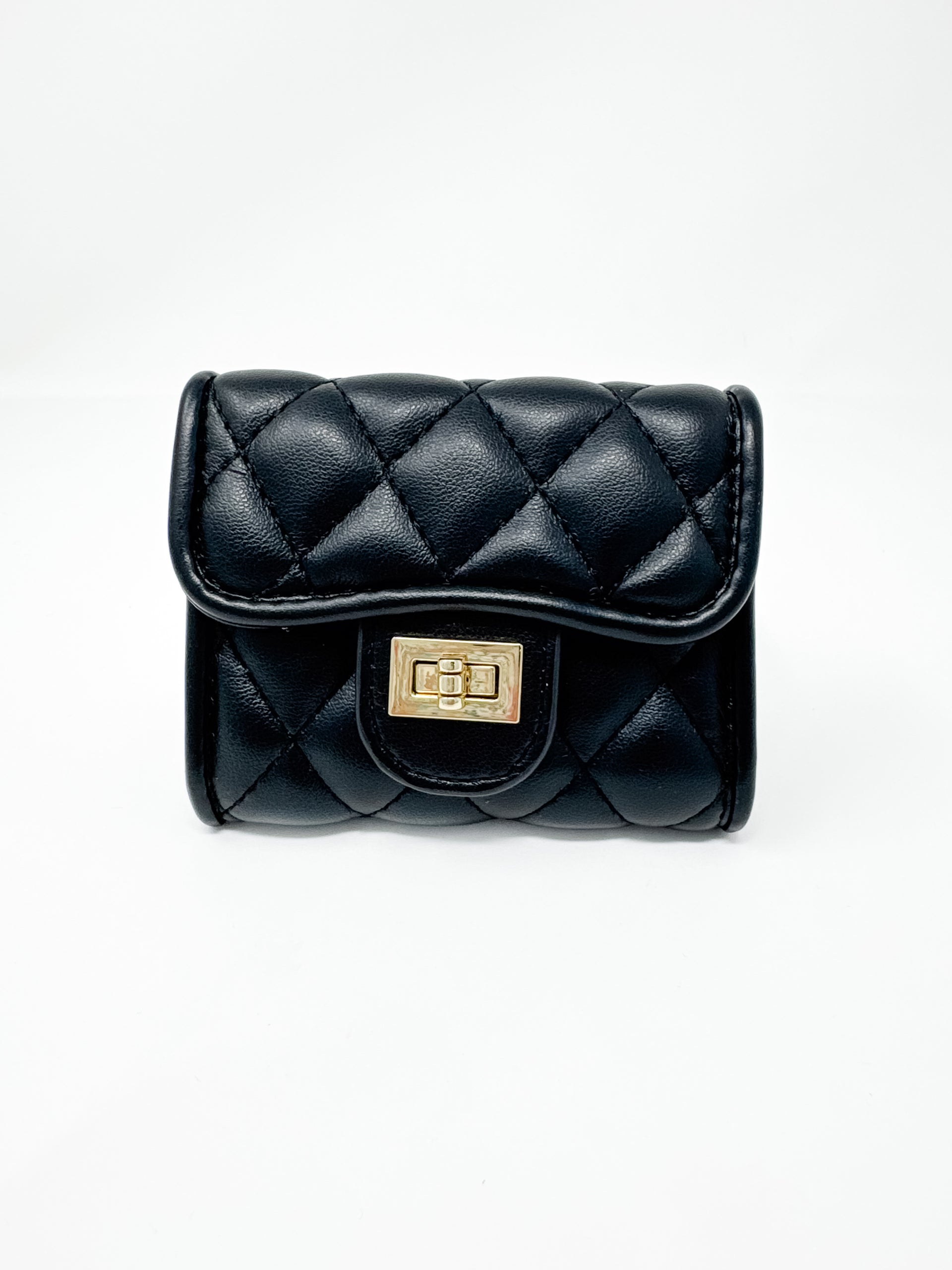 A small, compact black faux-leather wallet displayed against a solid white background. The wallet features a plush diamond-quilted pattern, a curved front flap, and a polished gold-toned metal turn-lock closure.