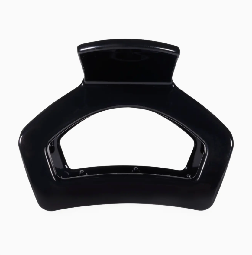 A glossy black hair claw clip shown from a top-down view against a plain white background.