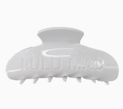 A glossy white hair claw clip with the brand name 'LULU MAC' embossed on the front, shown against a plain white background.