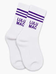 A pair of white crew socks with purple stripes and 'LULU MAC' text on the side, displayed against a clean white background.