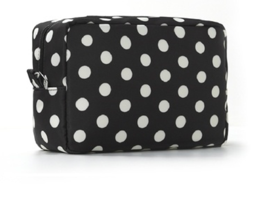 A rectangular black zippered pouch with a white polka dot pattern, shown on a clean white background.